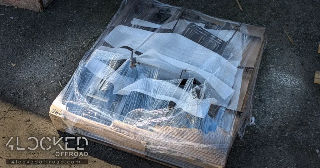 Foam-Wrapped 3rd-Gen 4Runner ARB Brackets on Pallet – 4Locked Offroad Foam-wrapped, shrink-wrapped pallet of Cardinal wrinkle-black ARB compressor brackets for a 3rd-gen Toyota 4Runner.
